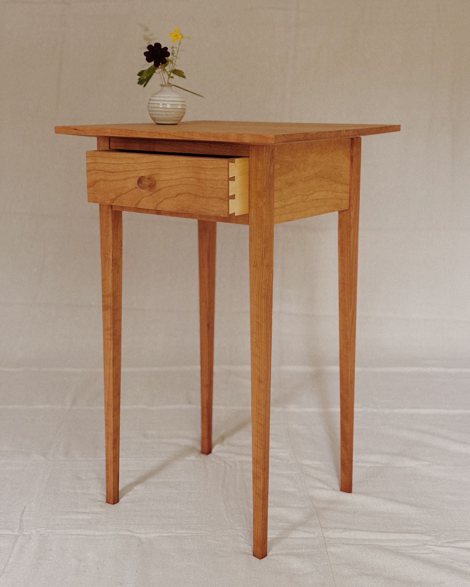 Side table in black cherry and basswood